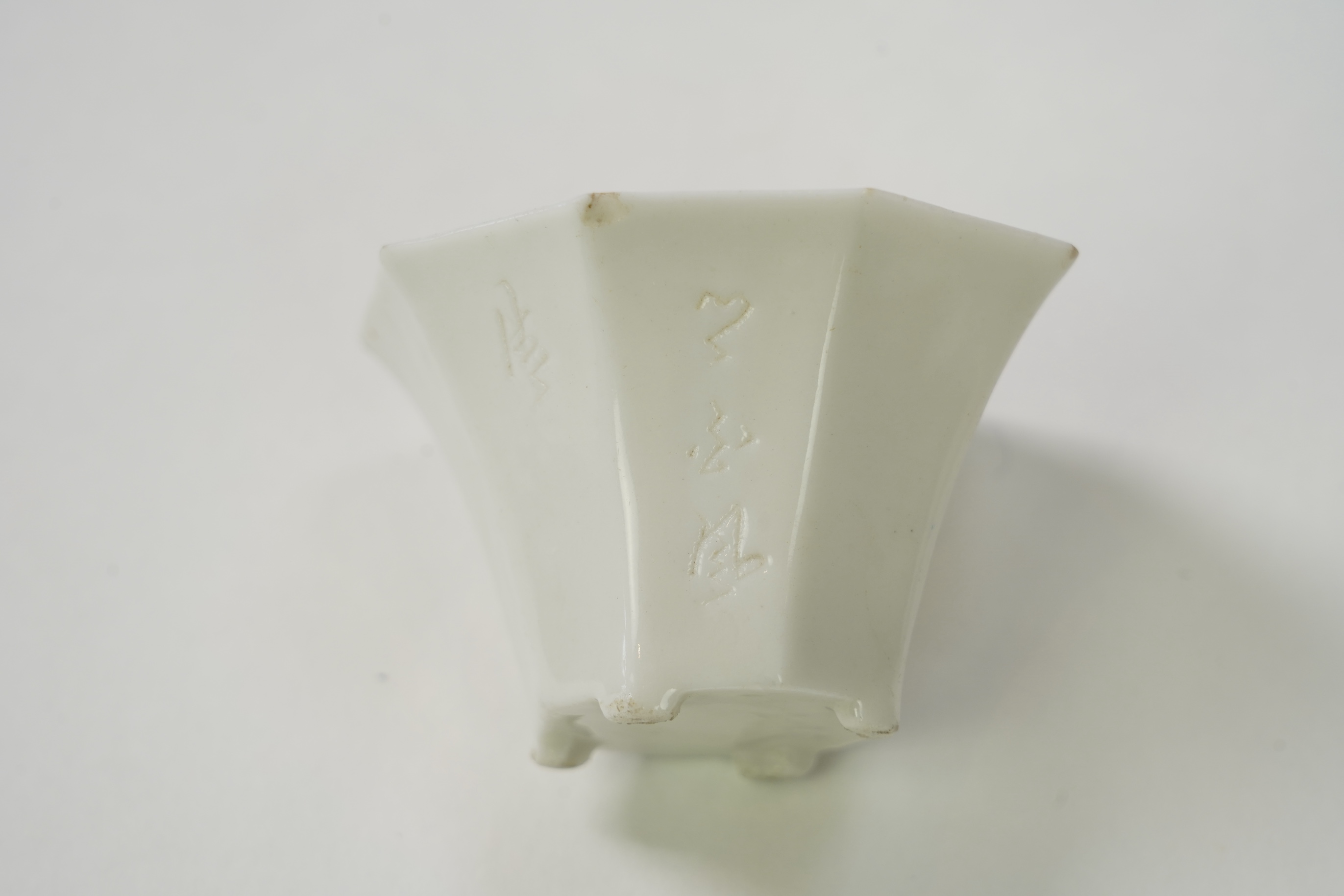 Two Chinese Dehua blanc de chine octagonal cups, Kangxi period